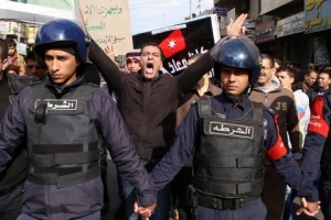 People shout slogans to call for the freedom of Jordanian pilot Mu’ath al-Kaseasbeh, held by the Islamic State group in the Syrian city of Raqqa.  (AP Photo/Raad Adayleh)