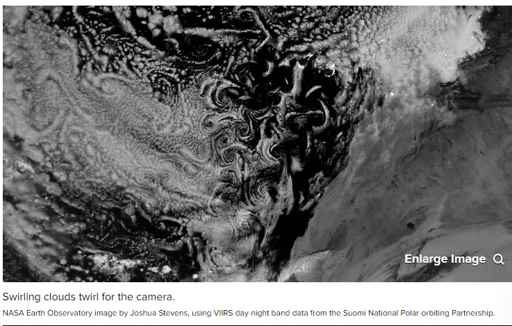NASA eyes trippy tie-dye clouds in wild nighttime view